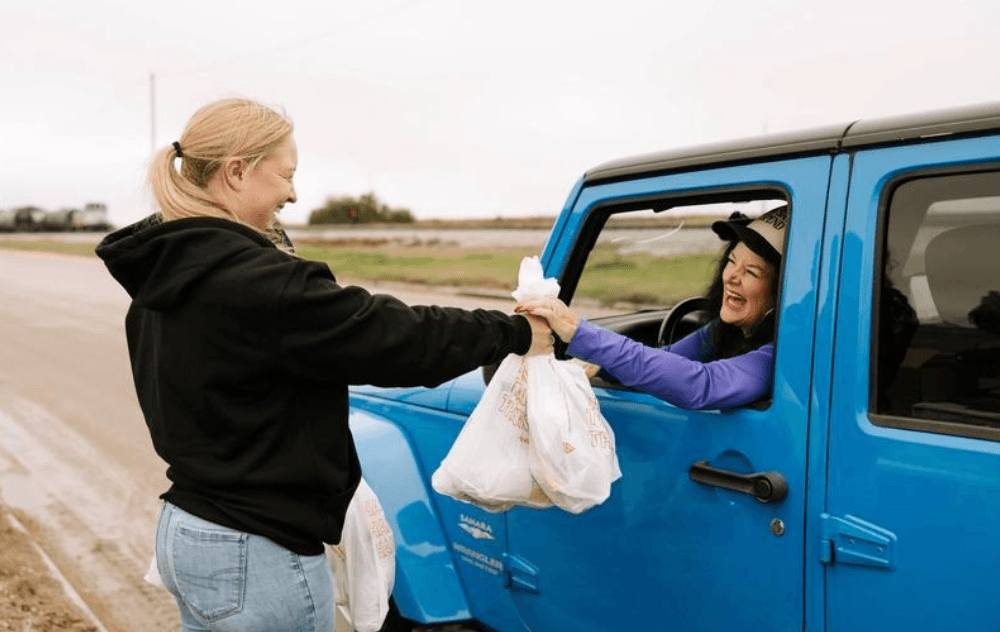 woman sharing with neighbor